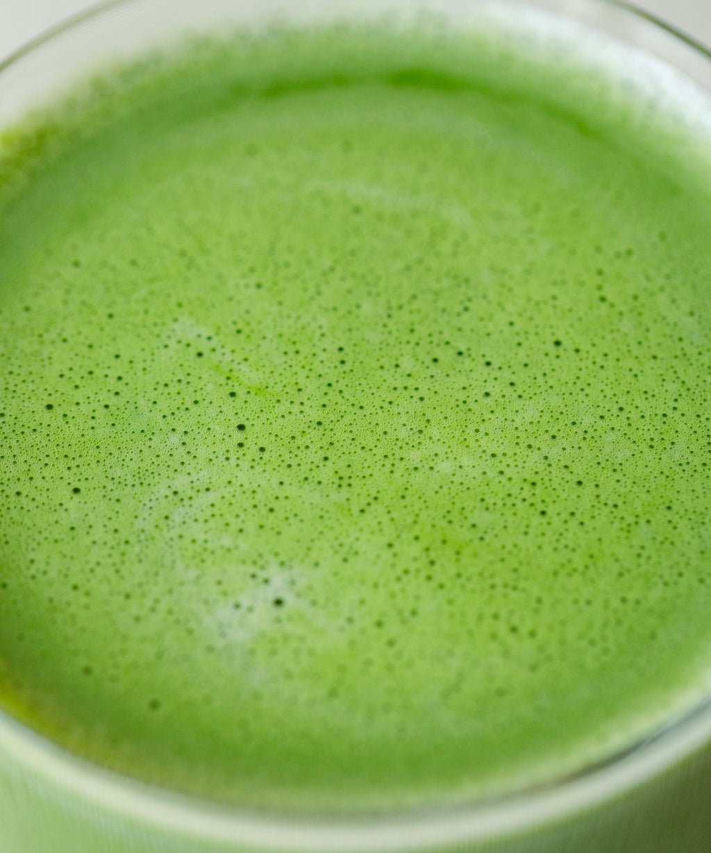 Preparing Saemidori matcha latte in a clear glass