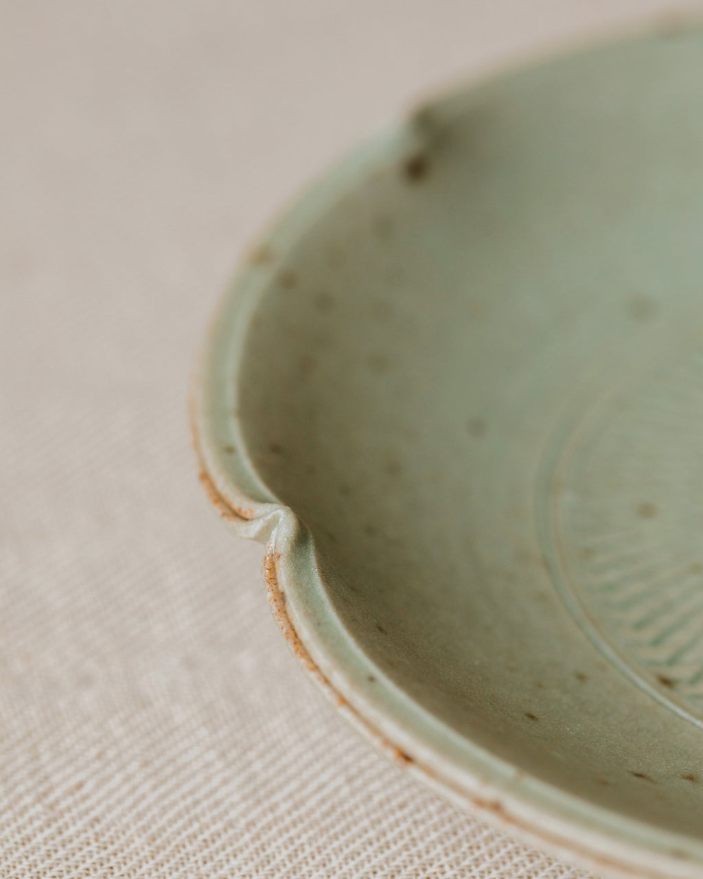 Scalloped Plate Faded Robin's Egg side view, organic scalloped form, handcrafted by Wang Xinghua, Jingdezhen