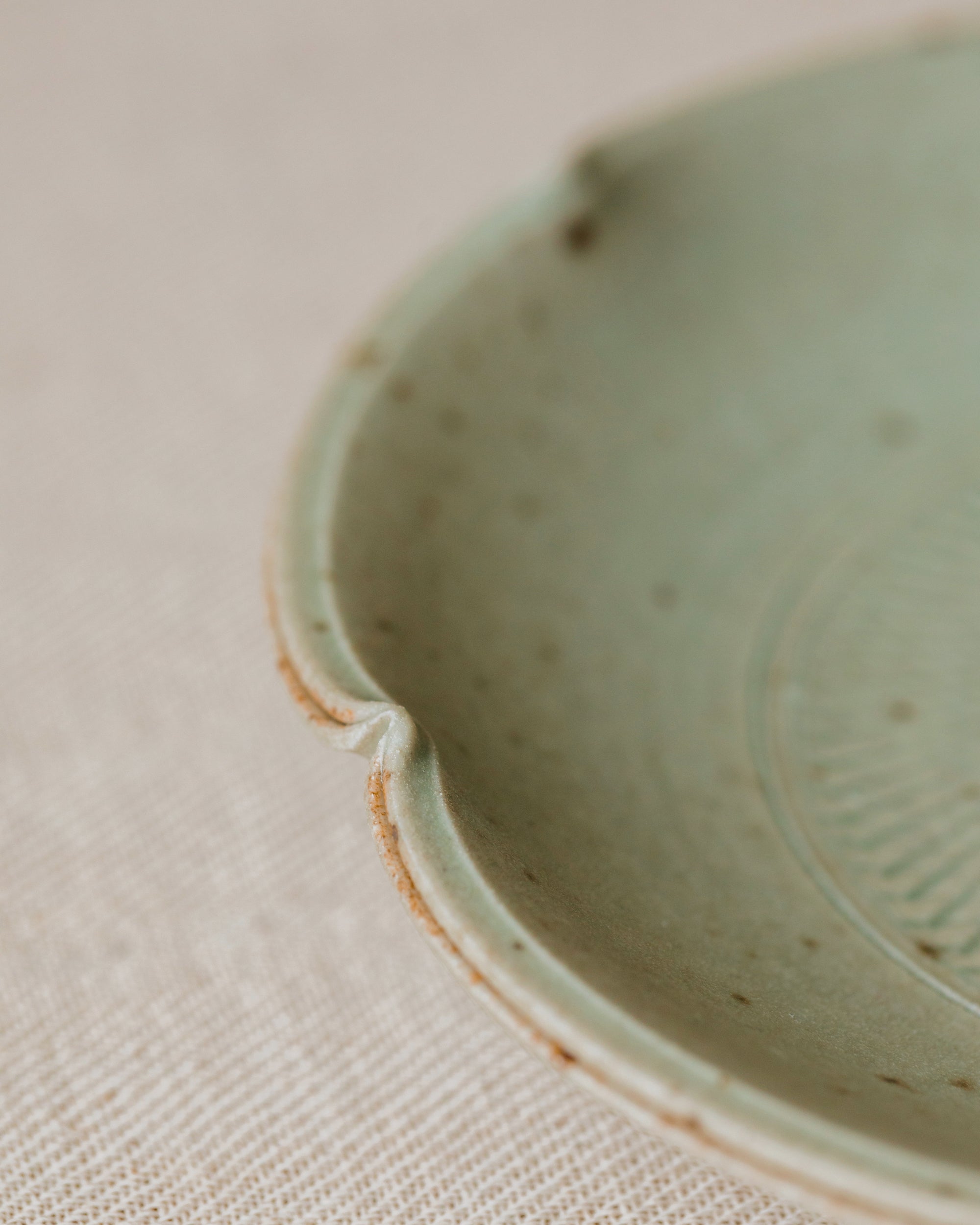 Scalloped Plate Faded Robin's Egg side view, organic scalloped form, handcrafted by Wang Xinghua, Jingdezhen