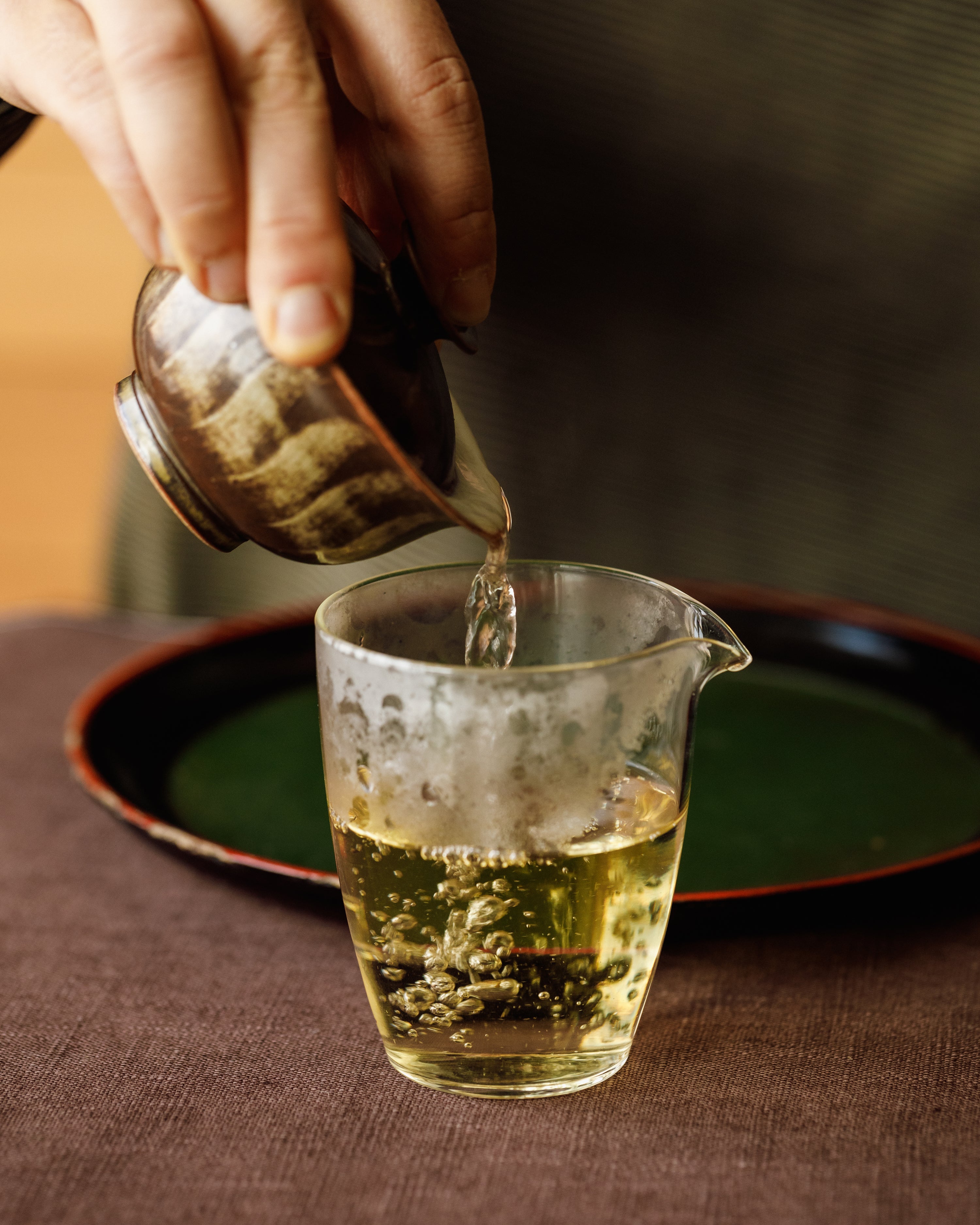 Autumn Tieguanyin unfurling in hot water, releasing orchid fragrance