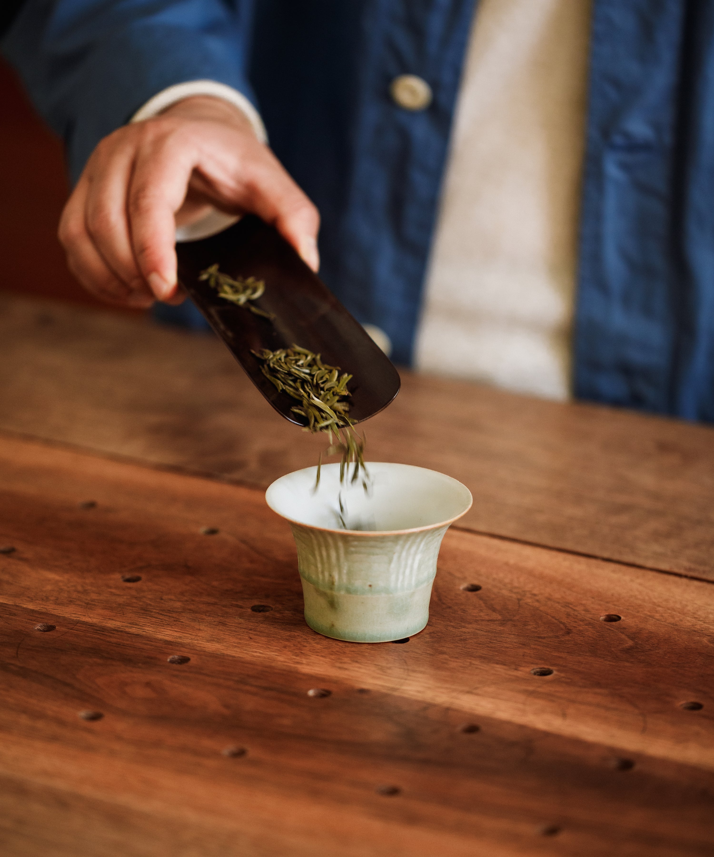 Gardenia Bird's Tongue buds on spoon — over 300 first harvest buds per cup from Mengding Mountain, Ya'an