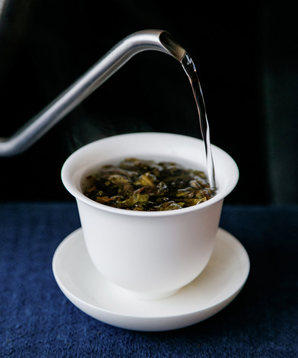 Ancient Tree Yellow Leaf liquor — gentle, sweet sheng pu'erh with clarity and energy, Jinggu