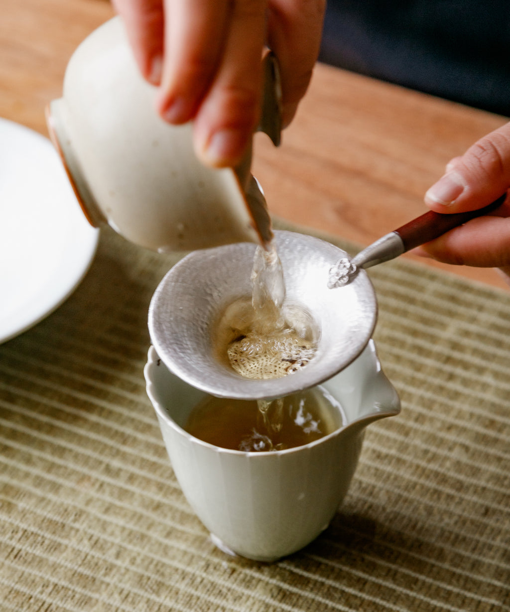 Hot water poured over Purple Cloud leaves in a gaiwan
