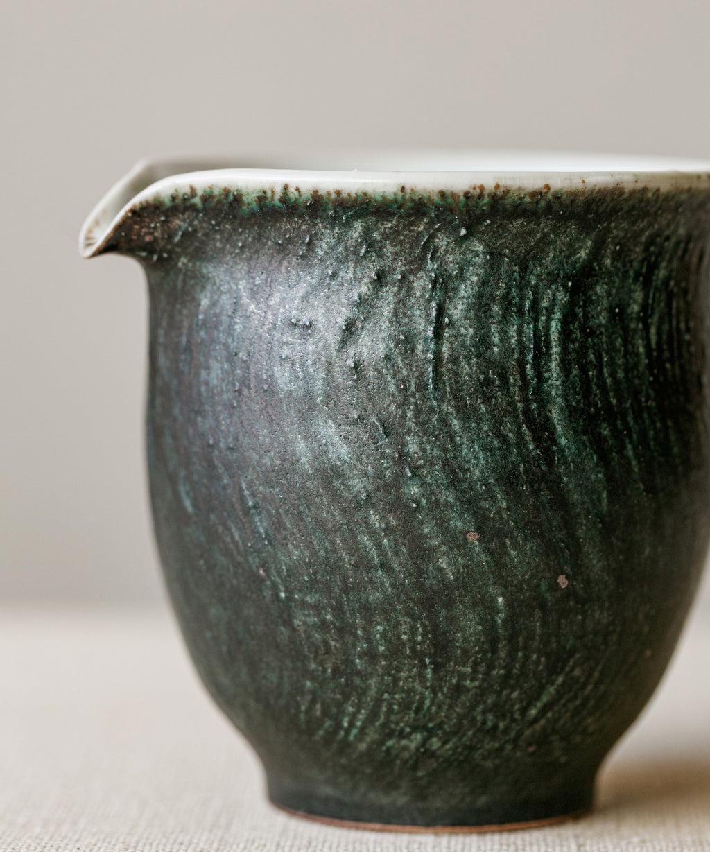 Space Green Pitcher Type VI in hand, curved spout for precise pours, Wang Xinghua gongfu teaware