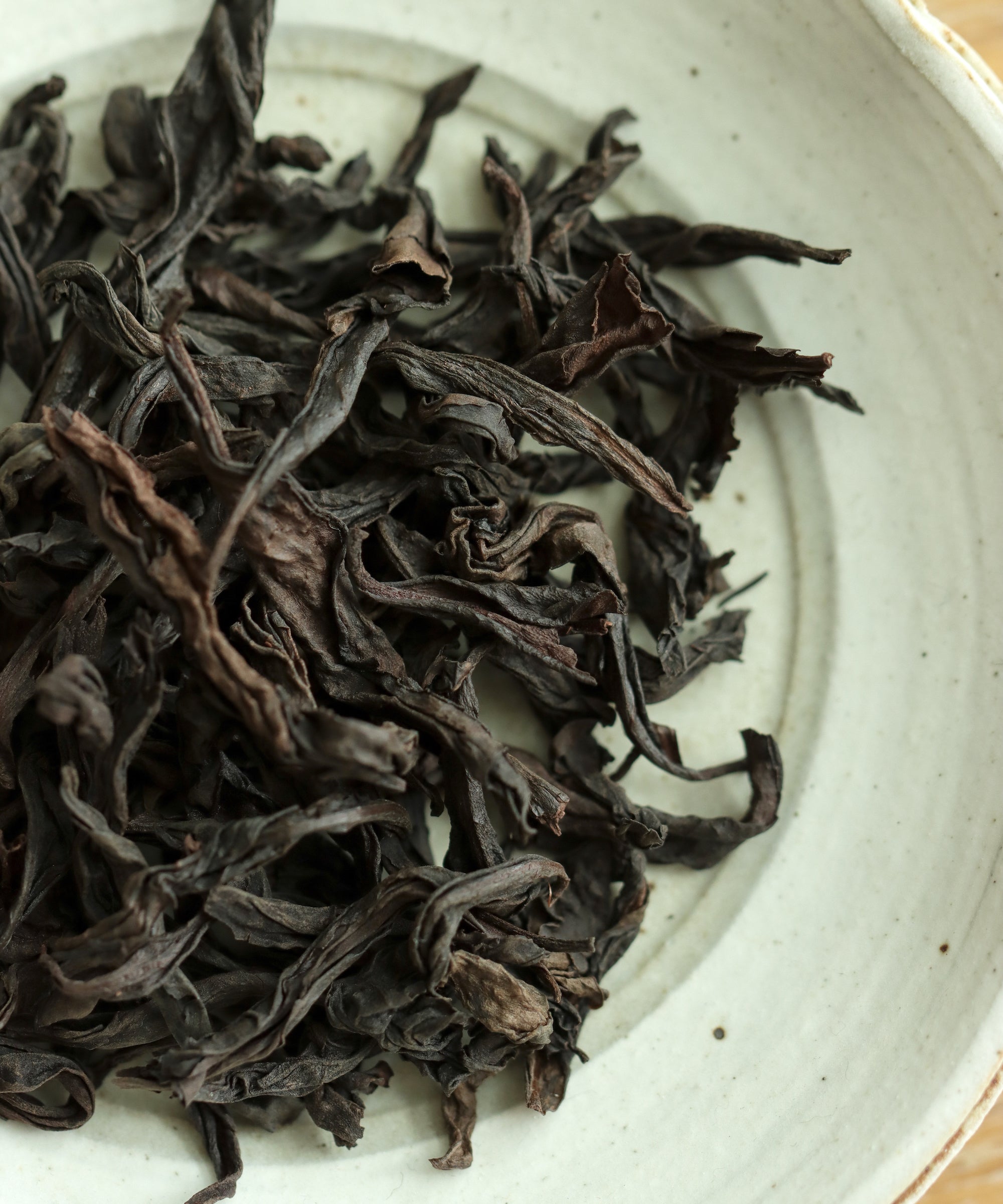 Tieluohan dry leaves — one of four prestigious Wuyi cliff oolong varietals, Fan Zhiqiang, Xingcun, Fujian