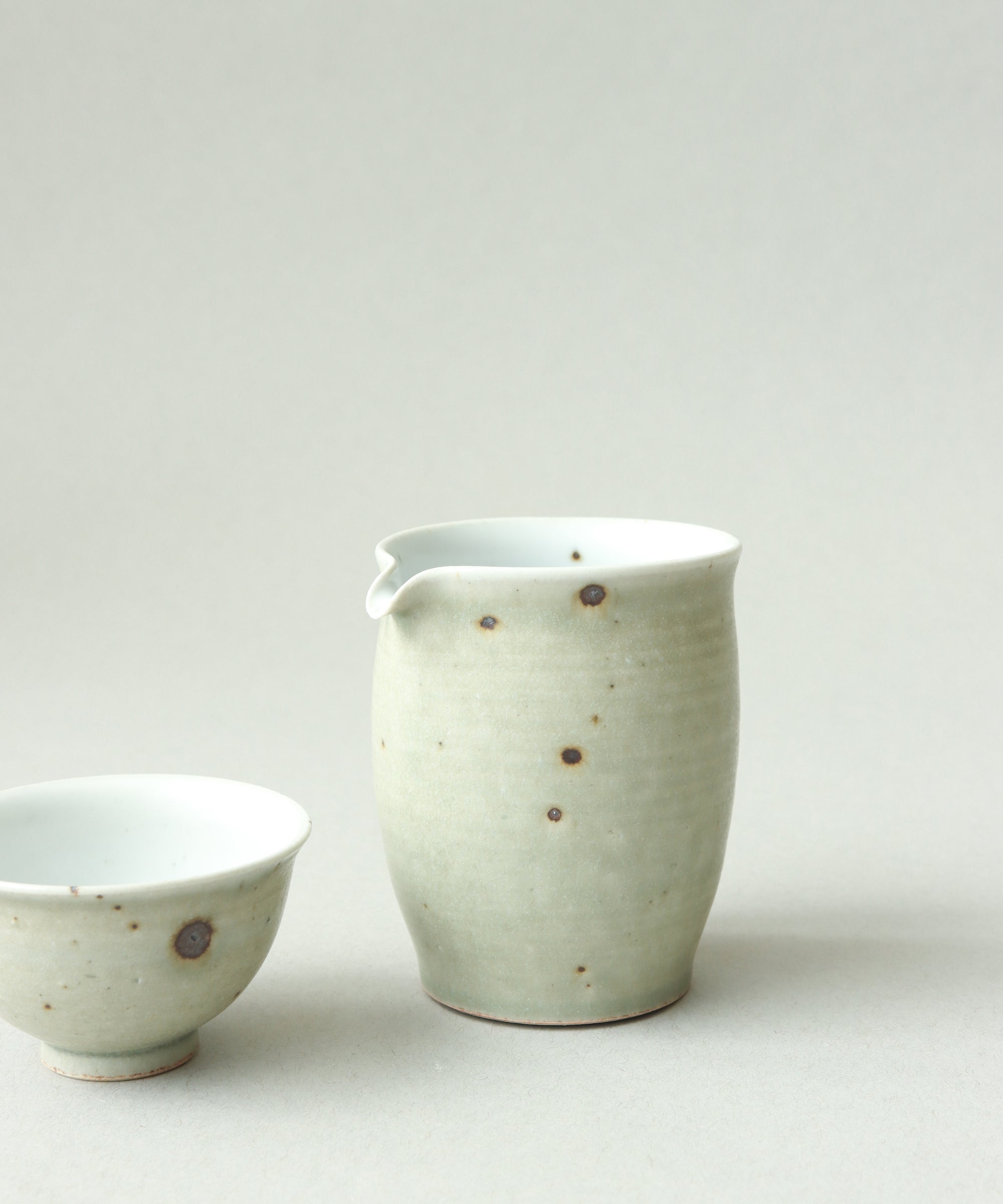 Green Celadon Pitcher Type IV in use, pouring tea, matte green celadon pitcher by Wang Xinghua, Jingdezhen