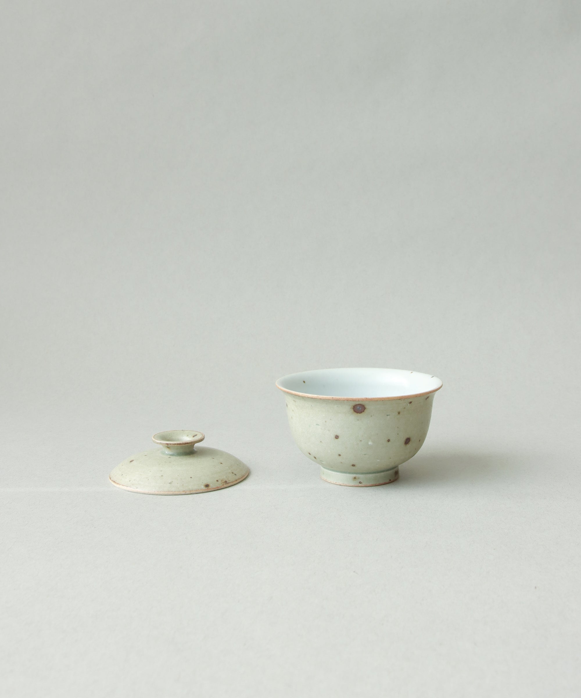 Green Celadon Gaiwan Type III in hand, matte green celadon surface, Wang Xinghua gongfu teaware