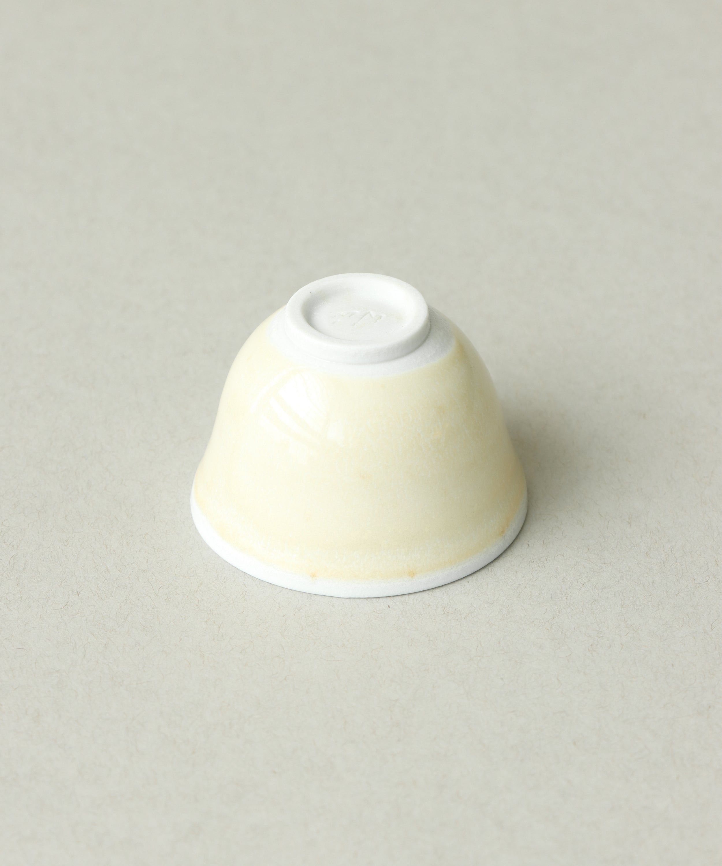Yellow Bamboo Tea Cup underside, soda-fired porcelain clay body