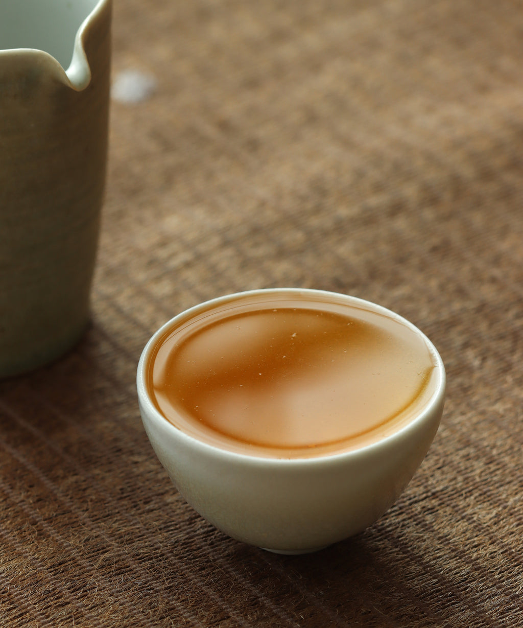 Celadon Tea Cup in hand, handcrafted at Shadbolt Centre, Burnaby BC