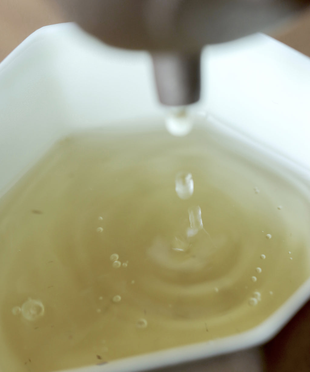 Brewed Silver Needle showing pale yellow liquor with sweet sustained finish