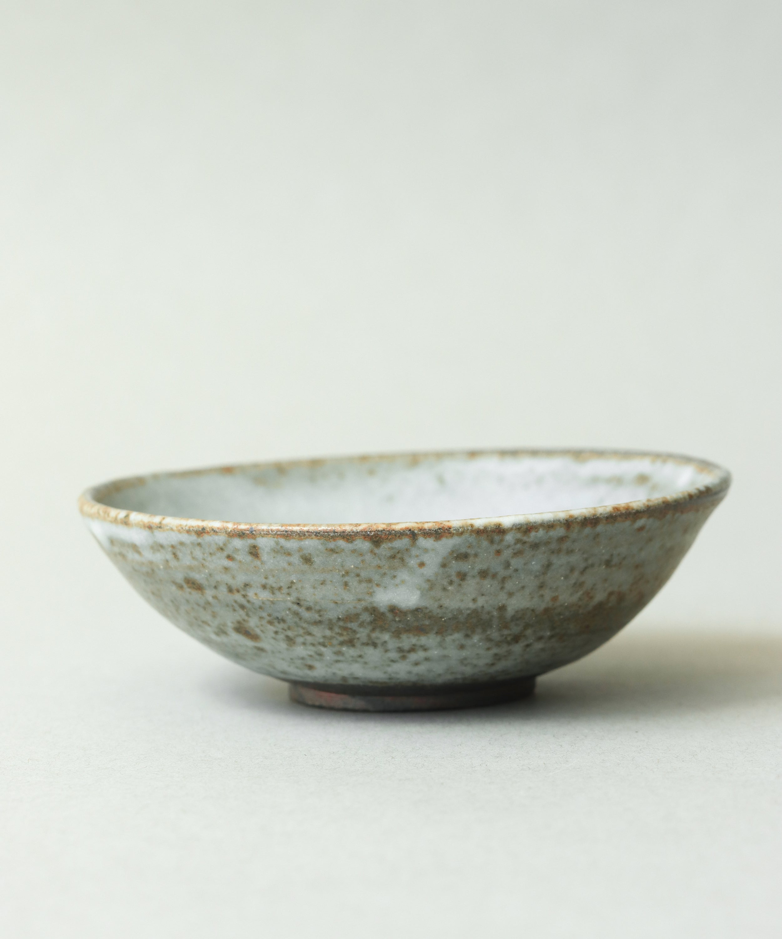 Zisha Plate One glaze detail, cream glaze reacting with Yixing zisha clay