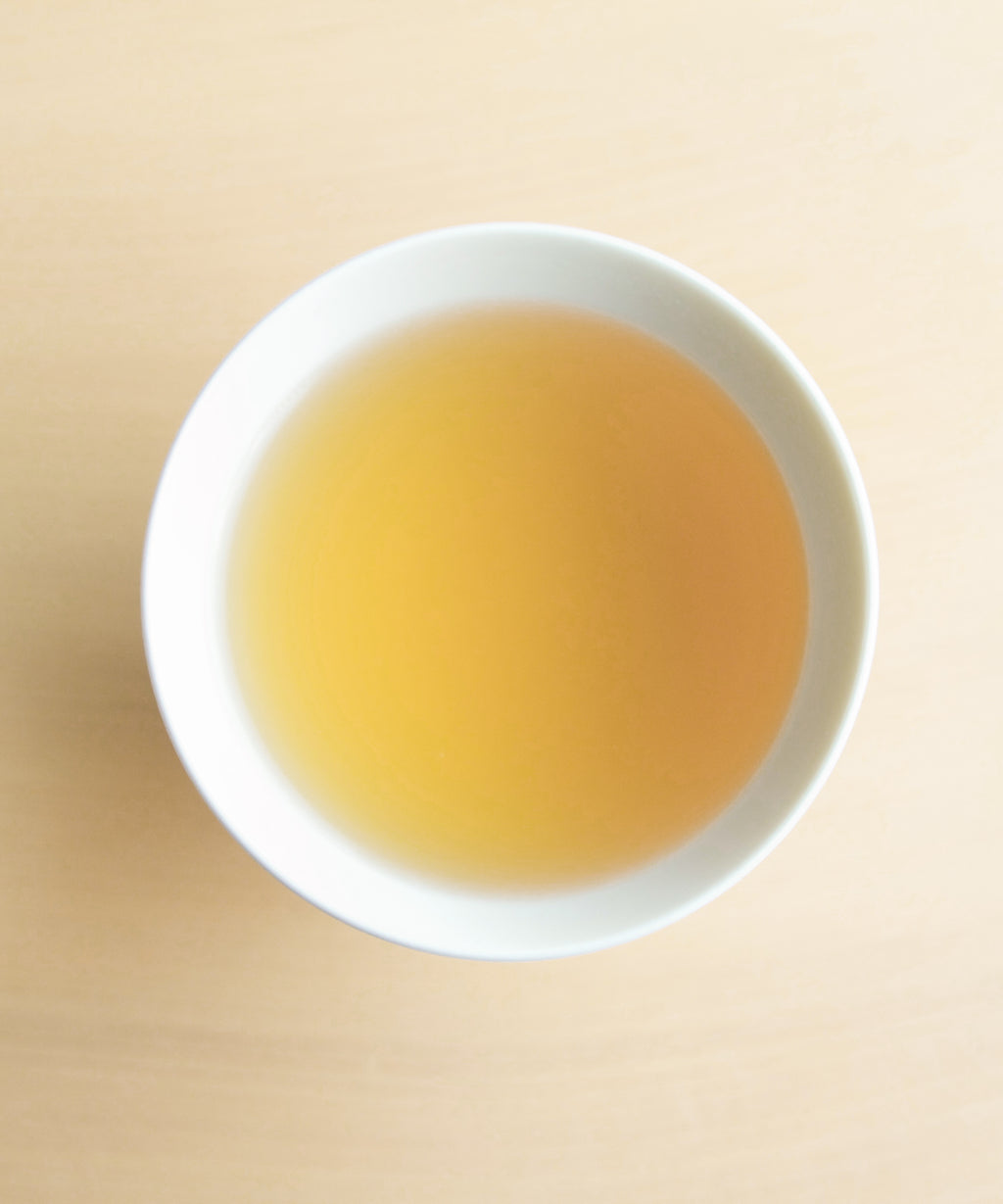 Roasted Rock liquor — auburn black tea with ash, aged wood, and incense notes, Zhenghe